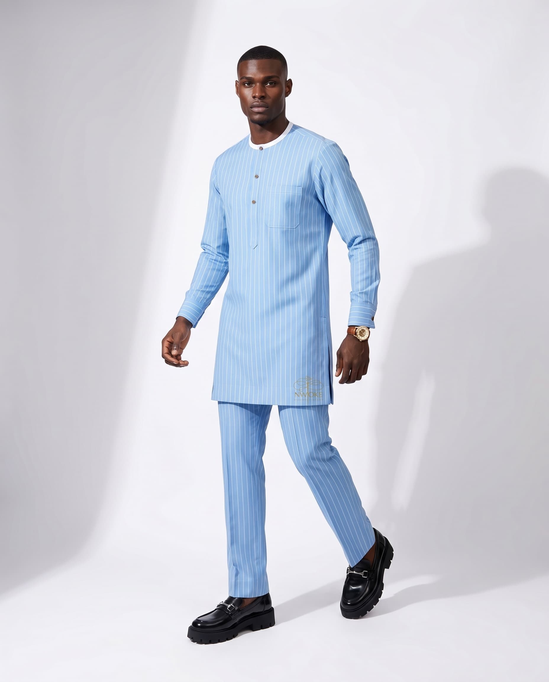A model walking in the Sky Pinstripe senator with black loafers